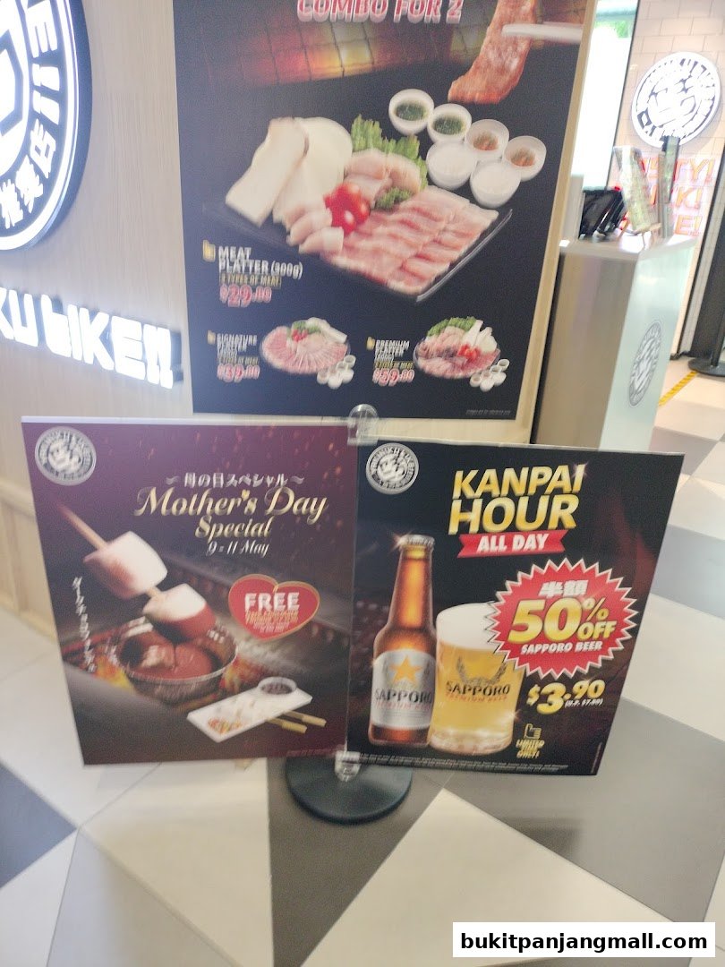 Promotional posters for Yakiniku Like, featuring meat platters, Mother's Day special, and Sapporo beer.