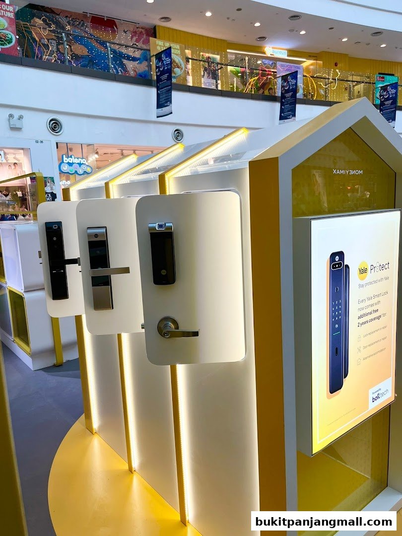 Display of Yale smart locks with promotional signage in a retail store.