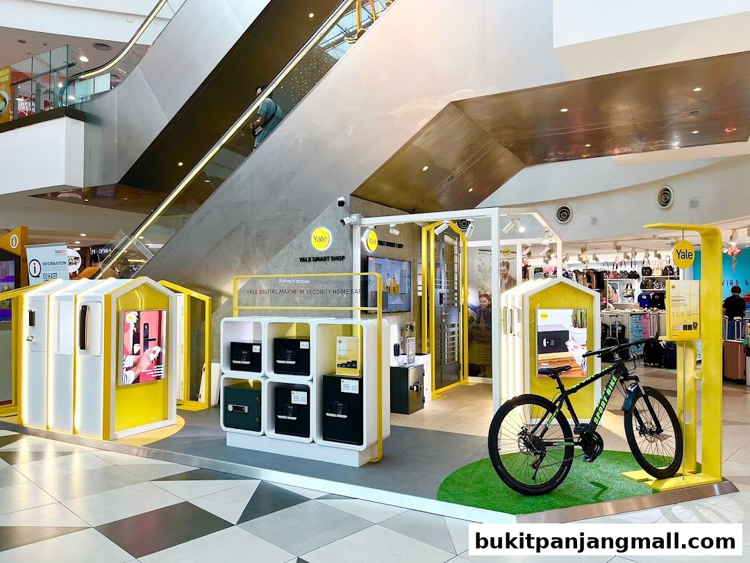 The Yale Smart Shop display features smart home security products and a bicycle.