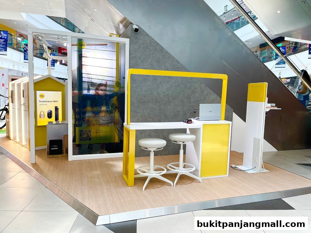 A Yale Smart Shop display featuring smart locks and security solutions with a seating area.