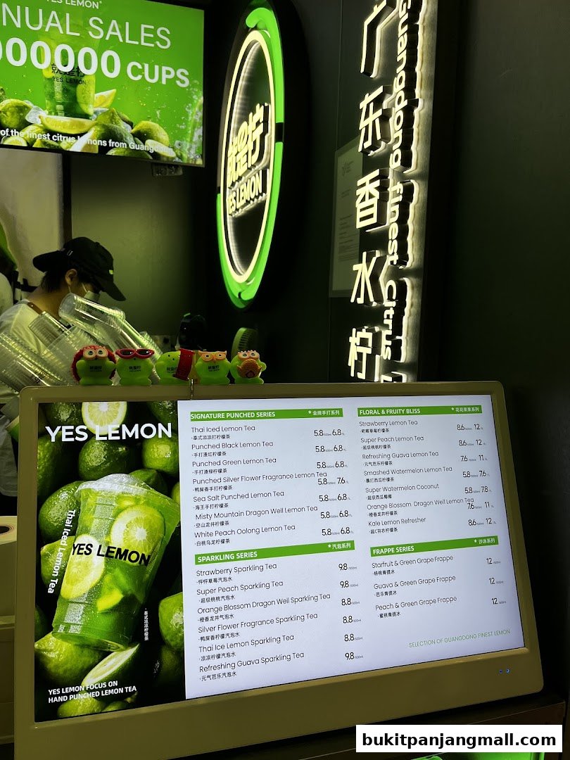 A digital menu board displaying various lemon tea drinks and their prices.