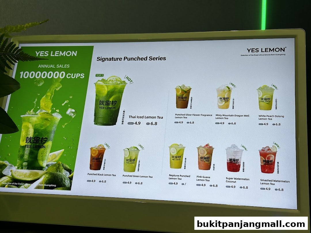 A digital menu board displaying various lemon tea drinks from YES LEMON.