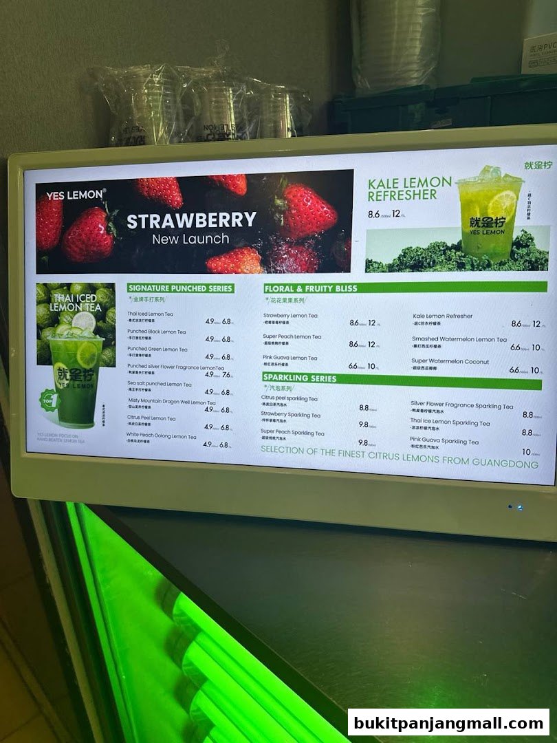 A digital menu displaying various lemon tea and sparkling drinks with prices.